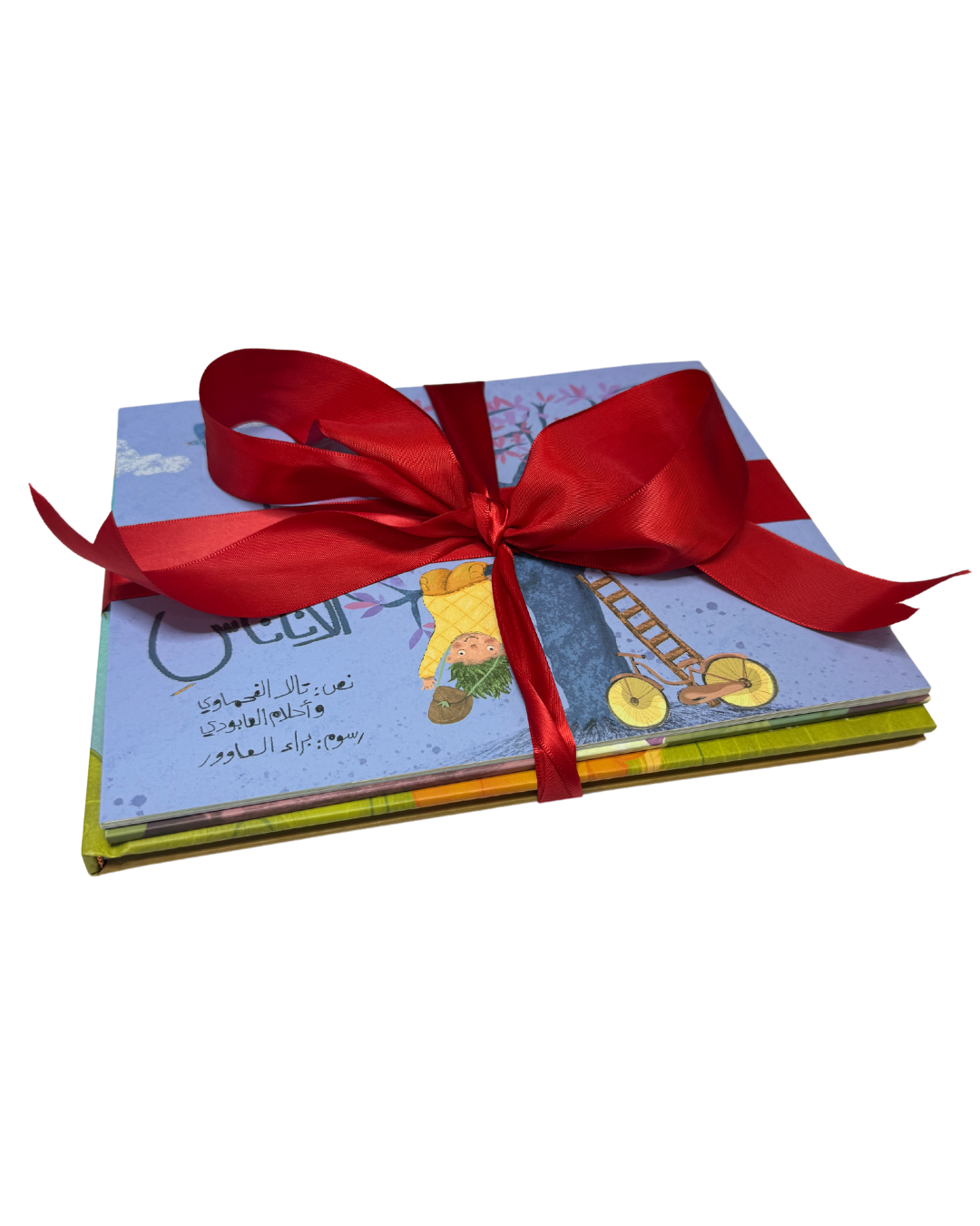 Stack of Arabic children's storybooks tied with a red ribbon, featuring bilingual Palestinian literature from Good Rain Publishing, perfect for gifting